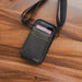 Black AgozTech Point Mobile scanner holster with crossbody sling on wood surface