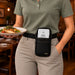 Restaurant server wearing Clover Flex POS terminal holster with rugged waist belt