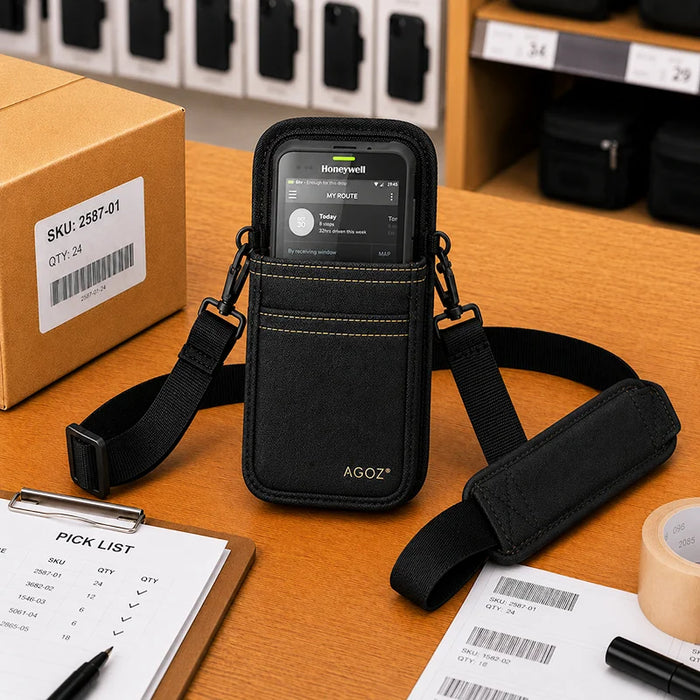 Black Honeywell shoulder sling holster on a warehouse workstation with Honeywell handheld computer, pick list, barcode labels, and packing supplies.