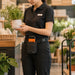 Retail worker wearing Sunmi POS terminal case on waist belt