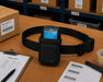 a black waist belt case for Elo scanner on a warehouse table