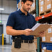 warehouse manager carrying an Urovo handheld scanner in a rugged AGOZ brand belt clip case