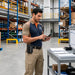 Leather Datalogic barcode scanner case worn on a warehouse worker’s belt during daily scanning and logistics tasks.