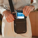 Person placing PAX A800 payment terminal into AgozTech black shoulder case