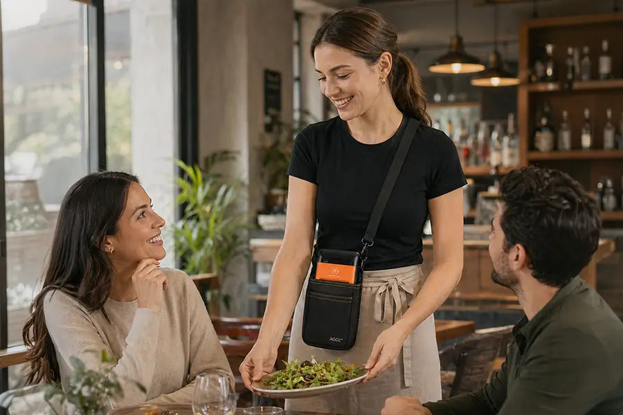Restaurant server wearing Sunmi POS terminal pouch as crossbody sling