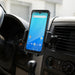 Unitech mobile scanner secured in an AgozTech air vent vehicle cradle mount inside a commercial vehicle dashboard.